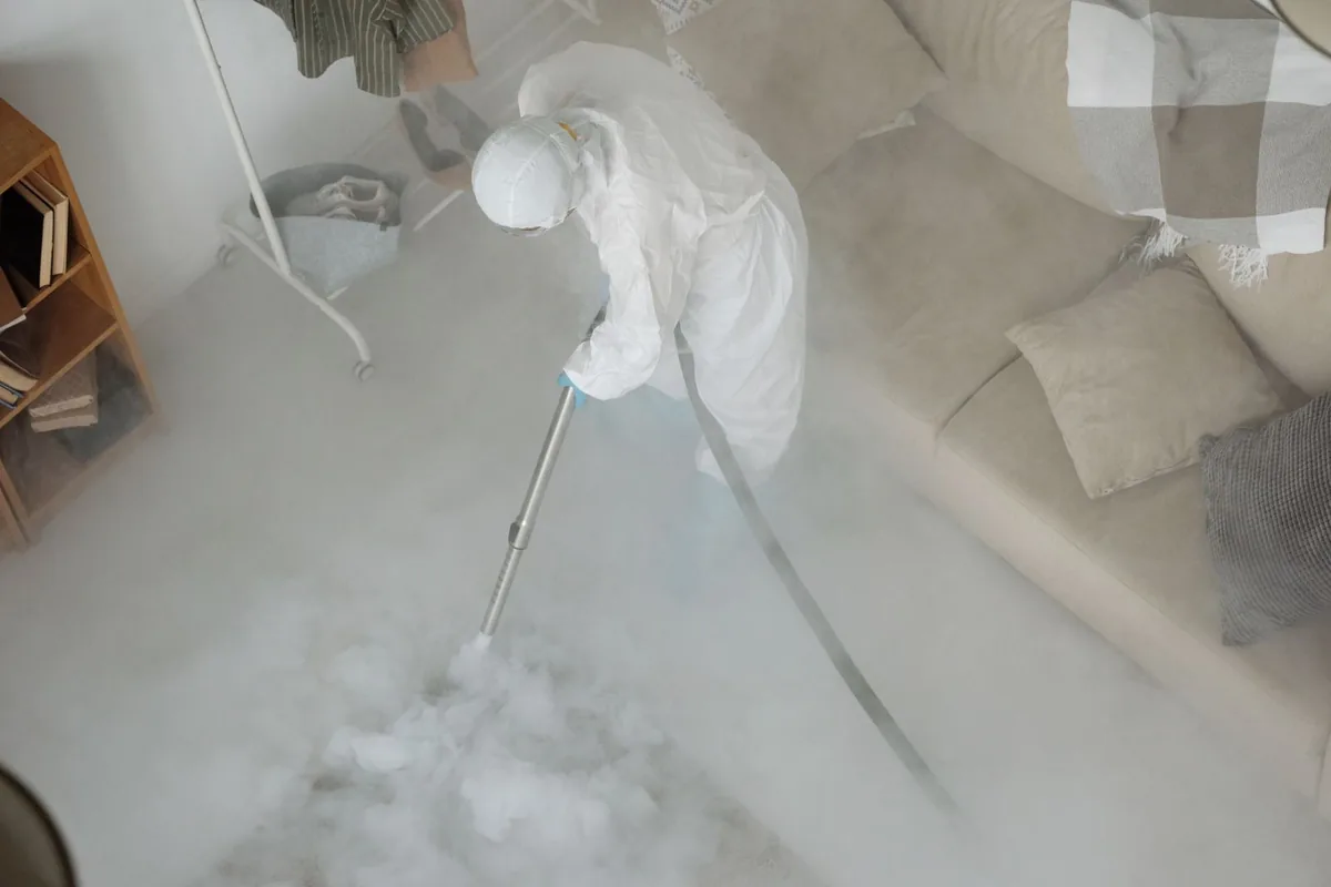 Biohazard cleanup technician in protective equipment, Maysville, KY